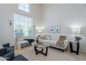 Inviting living room with a soaring window and neutral decor providing a serene space for relaxation at 2135 S Bristol --, Mesa, AZ 85209