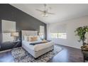 Bright main bedroom features a modern ceiling fan and large windows providing lots of natural light at 2135 S Bristol --, Mesa, AZ 85209