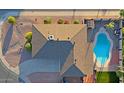 Birds eye view showcasing roof, driveway, landscaping, outdoor shed, and private pool area of the property at 3054 W Redfield Rd, Phoenix, AZ 85053