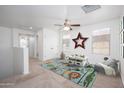 Bright play room with carpet, fun decor, a ceiling fan, and lots of natural light at 3361 E Wisteria Pl, Chandler, AZ 85286