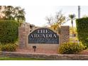 Elegant stone sign for The Arcadia Residences with lush landscaping and manicured grounds at 3825 E Camelback Rd # 290, Phoenix, AZ 85018