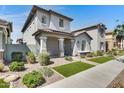 Inviting home exterior featuring low maintenance landscaping and a covered porch with stylish architectural accents at 4332 E Boston St, Gilbert, AZ 85295