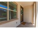 A welcoming entrance with a view of the front door, stylish window, and 'Welcome' doormat at 4711 S Vapor --, Mesa, AZ 85212
