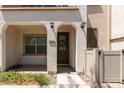 Inviting front entrance with a decorative wreath, covered porch, and landscaped surroundings at 4711 S Vapor --, Mesa, AZ 85212