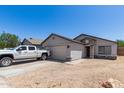 Charming single-story home with a two-car garage and desert landscaping at 4741 N 85Th Ave, Phoenix, AZ 85037