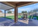 Covered patio with brick pavers and an outdoor dining set, perfect for relaxation at 48069 N Rico Way, Gold Canyon, AZ 85118