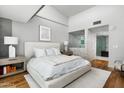 Spacious main bedroom featuring hardwood floors, large windows, and ensuite bathroom with marble at 5455 E Lincoln Dr # 3006, Paradise Valley, AZ 85253