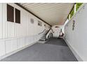 The covered patio features ample space with a sitting swing and stairwell access at 5534 E Player Pl, Mesa, AZ 85215