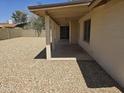 View of covered back patio overlooking large backyard area, great for entertaining or relaxing at 5608 W Carol Ave, Glendale, AZ 85302