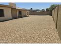 Expansive backyard with low maintenance desert landscaping, perfect for outdoor activities at 5608 W Carol Ave, Glendale, AZ 85302