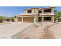 Charming two-story home with desert landscaping and spacious driveway at 6276 N 75Th Ln, Glendale, AZ 85303