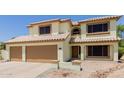 Inviting two-story home featuring a three-car garage and neutral-toned exterior at 6276 N 75Th Ln, Glendale, AZ 85303