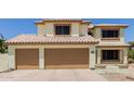 Spacious three-car garage with automatic doors and tile roof at 6276 N 75Th Ln, Glendale, AZ 85303