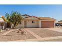 Attractive single-story home with mature landscaping and a welcoming entrance at 7849 E Golf Ave, Mesa, AZ 85209