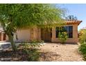 Charming single-story home with well-maintained front yard, garage, and desert landscaping at 8541 W Malapai Dr, Peoria, AZ 85345