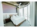 Bedroom featuring large windows with a city view and modern decor at 1 E Lexington Ave # 1306, Phoenix, AZ 85012