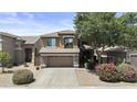 Beautiful two-story home featuring a two-car garage, stone accents, tidy landscaping, and mature shade trees at 1162 E Ranch Ct, Gilbert, AZ 85296