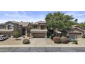 Charming two-story home boasts well-maintained landscaping, a two-car garage, and mature trees in a desirable neighborhood at 1162 E Ranch Ct, Gilbert, AZ 85296