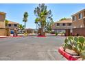 Gated community entrance with desert landscaping, providing security and aesthetic appeal at 1335 E June St # 221, Mesa, AZ 85203