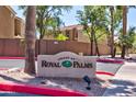 Villas at Royal Palms community sign with lush landscaping and well-maintained exterior at 1335 E June St # 221, Mesa, AZ 85203