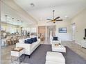 Spacious living room with a modern design, neutral tones, and plenty of natural light at 14572 W Medlock Dr, Litchfield Park, AZ 85340