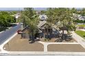 Beautiful single-Gathering home with mature landscaping showcasing the home's architectural design and curb appeal at 1750 E Mallory St, Mesa, AZ 85203