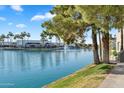 Scenic waterfront featuring a serene lake with fountain, lush green spaces, and convenient walking paths at 1825 W Ray Rd # 1119, Chandler, AZ 85224