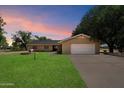 Charming ranch home with brick facade, mature trees, and a well-maintained lawn at 23265 S Via Del Arroyo --, Queen Creek, AZ 85142