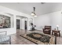 Spacious living room area showcasing tile floors, ample natural light, and neutral paint at 26264 N 74Th Ln, Peoria, AZ 85383