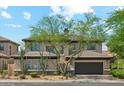 Charming two-story home featuring desert landscaping, a tile roof, and a spacious two-car garage at 3817 E Patrick Ln, Phoenix, AZ 85050