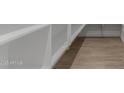 Walk-in pantry with custom shelves and tile flooring offers ample storage space at 40595 W Michaels Dr, Maricopa, AZ 85138