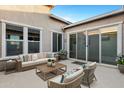 Cozy backyard patio with comfortable seating and a view of the lush greenery at 41584 W Springtime Rd, Maricopa, AZ 85138