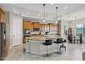 Bright, spacious kitchen with granite countertops and modern stainless steel appliances at 41584 W Springtime Rd, Maricopa, AZ 85138