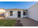 Inviting front entrance with a decorative security door and well-maintained landscaping at 4855 E Gary St, Mesa, AZ 85205