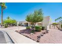 Attractive desert landscaping enhances this property, showcasing its beautiful curb appeal and outdoor charm at 5209 N 78Th St, Scottsdale, AZ 85250