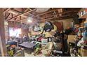 Cluttered garage space filled with tools, equipment, and various household items awaiting cleanup and organization at 604 W Emelita Ave, Mesa, AZ 85210