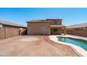 Backyard features pool and patio space, great for entertaining at 6944 S Morning Dew Ln, Buckeye, AZ 85326