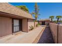 Charming exterior view of a home with a welcoming walkway and well-maintained landscaping at 909 S Acapulco Ln # A, Tempe, AZ 85281