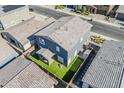 Aerial view of the home with artificial turf and a small putting green in the backyard at 9352 E Saturn Ave, Mesa, AZ 85212