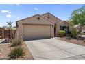 Attractive home with a two-car garage, drought resistant landscaping and a well-maintained front yard at 10333 E Gold Nugget Ct, Gold Canyon, AZ 85118