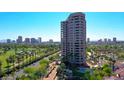 Stunning aerial view showcasing the high rise building with surrounding city skyline and beautiful landscape with swimming pool at 1040 E Osborn Rd # 501, Phoenix, AZ 85014