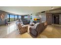 Spacious living room boasting a golf course view, modern decor and comfortable seating at 1040 E Osborn Rd # 501, Phoenix, AZ 85014