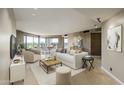 Elegant living room featuring a plush sofa, comfortable armchairs, and a decorative coffee table on a stylish rug at 1040 E Osborn Rd # 501, Phoenix, AZ 85014