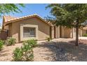 Beautifully landscaped home featuring drought-resistant gravel and decorative plants at 11206 W Sieno Pl, Avondale, AZ 85392