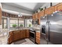 Well-equipped kitchen with granite counters, stainless steel appliances, and bright natural light at 11206 W Sieno Pl, Avondale, AZ 85392