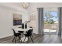 Chic dining area with modern lighting, round table, and outdoor access at 1633 E Lakeside Dr # 127, Gilbert, AZ 85234