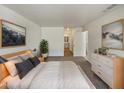 Bright main bedroom boasts neutral tones and an en suite bathroom for added privacy at 1739 E Carter Rd, Phoenix, AZ 85042