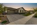 Beautiful home with a spacious three car garage and attractive brick driveway at 20795 W San Juan Ave, Buckeye, AZ 85396