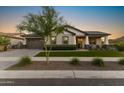 Charming single-Gathering home boasting a well-manicured lawn and a welcoming front porch perfect for relaxing at 20795 W San Juan Ave, Buckeye, AZ 85396