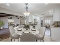 Dining area features a marble table, seating for four, and stylish decor at 2178 E Golf Ave, Tempe, AZ 85282